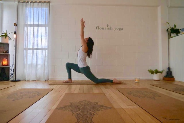 Warrior Pose on NZ designed Yoga Mats in Yoga Studio