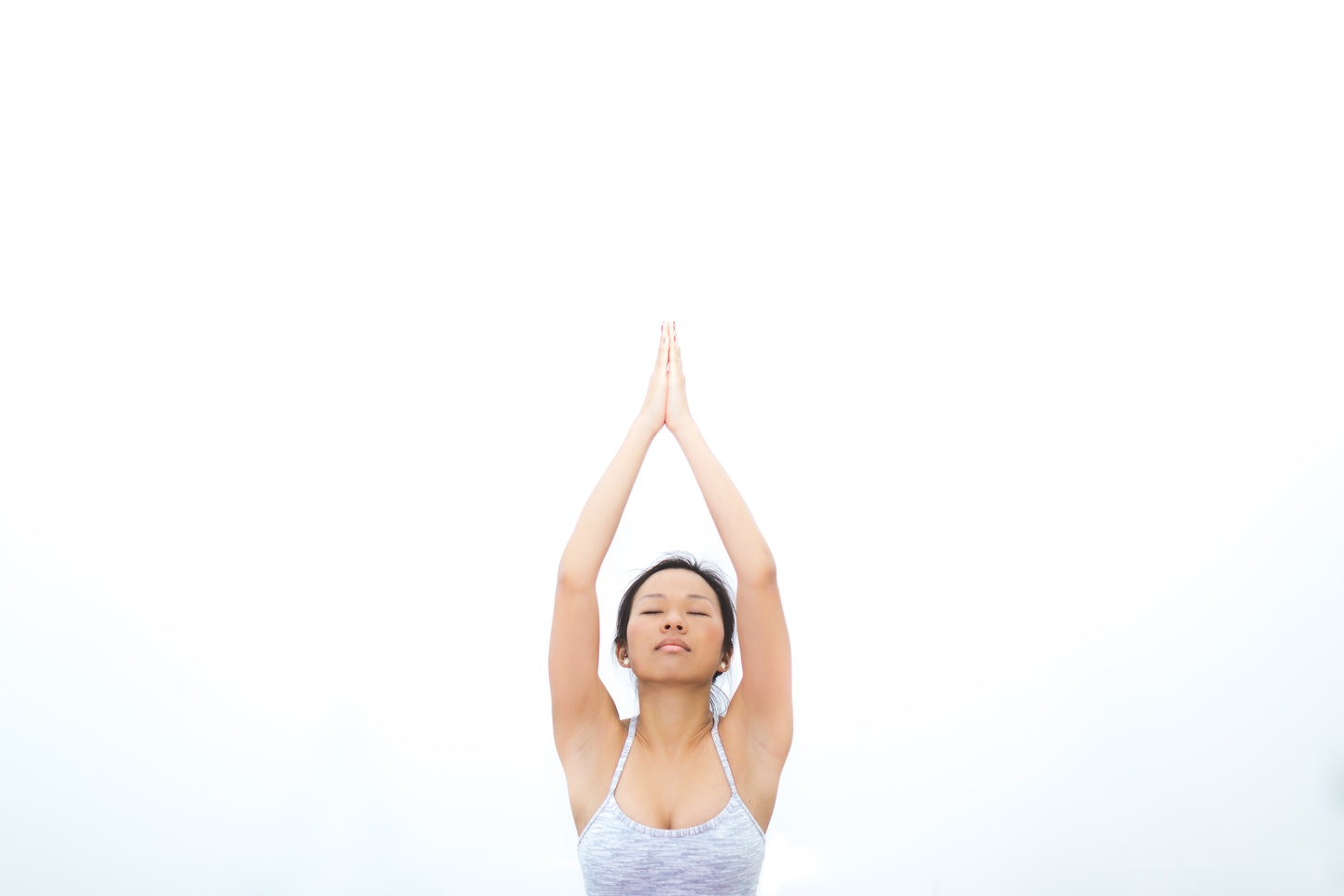 Yogini meditating and practising yoga in the morning