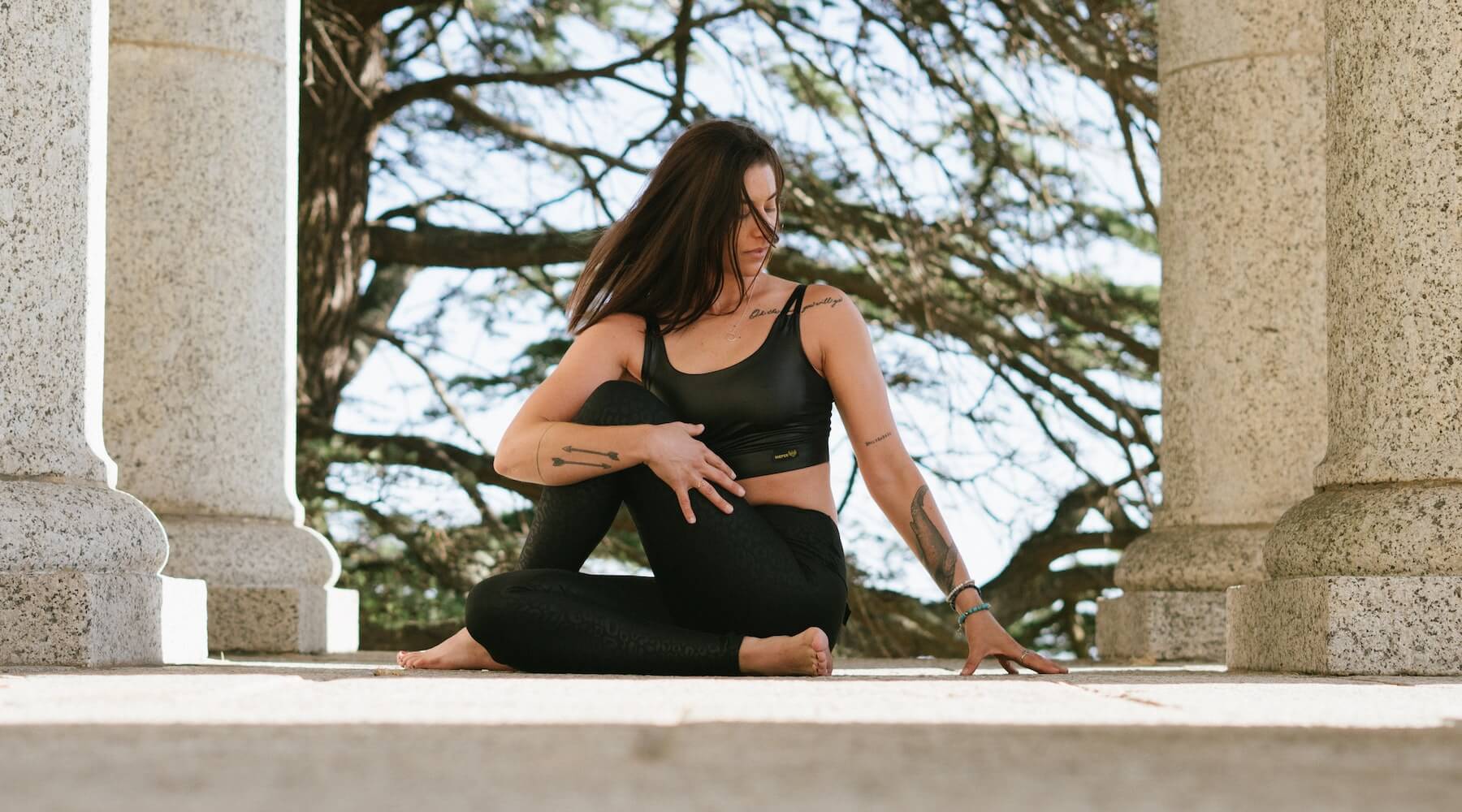 Yogini in a seated twist yoga pose