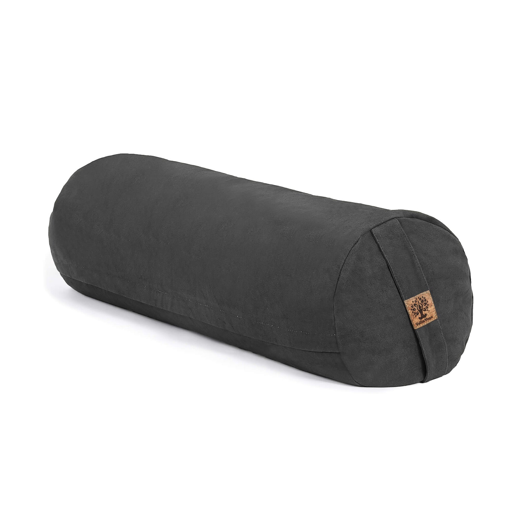 A charcoal grey cylindrical yoga bolster pillow with a small cork logo patch, shown on a clean white background