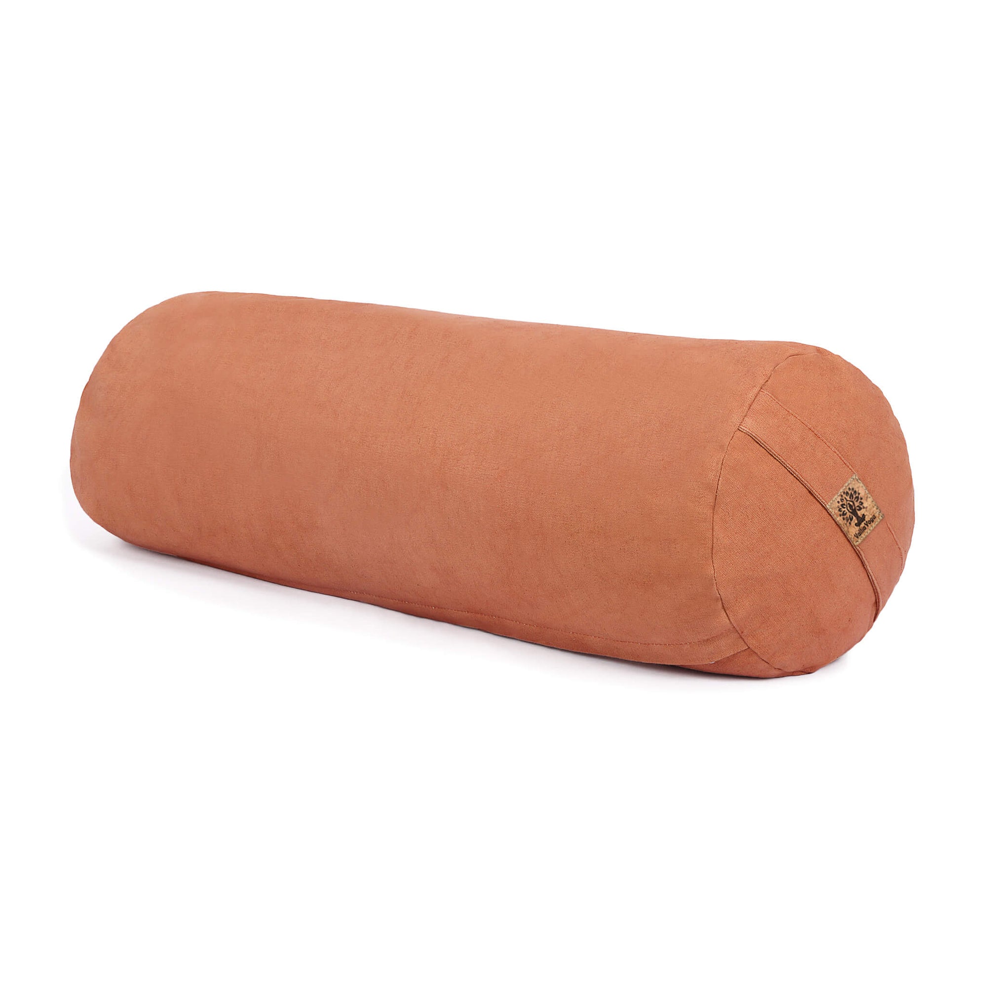A pink or orange cylindrical bolster pillow with a small cork brand tag, shown on a clean white background