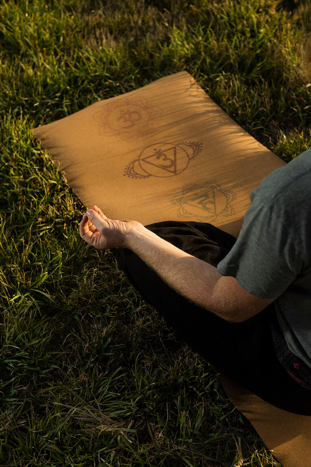 Yogi meditating on Chakra Yoga Mat