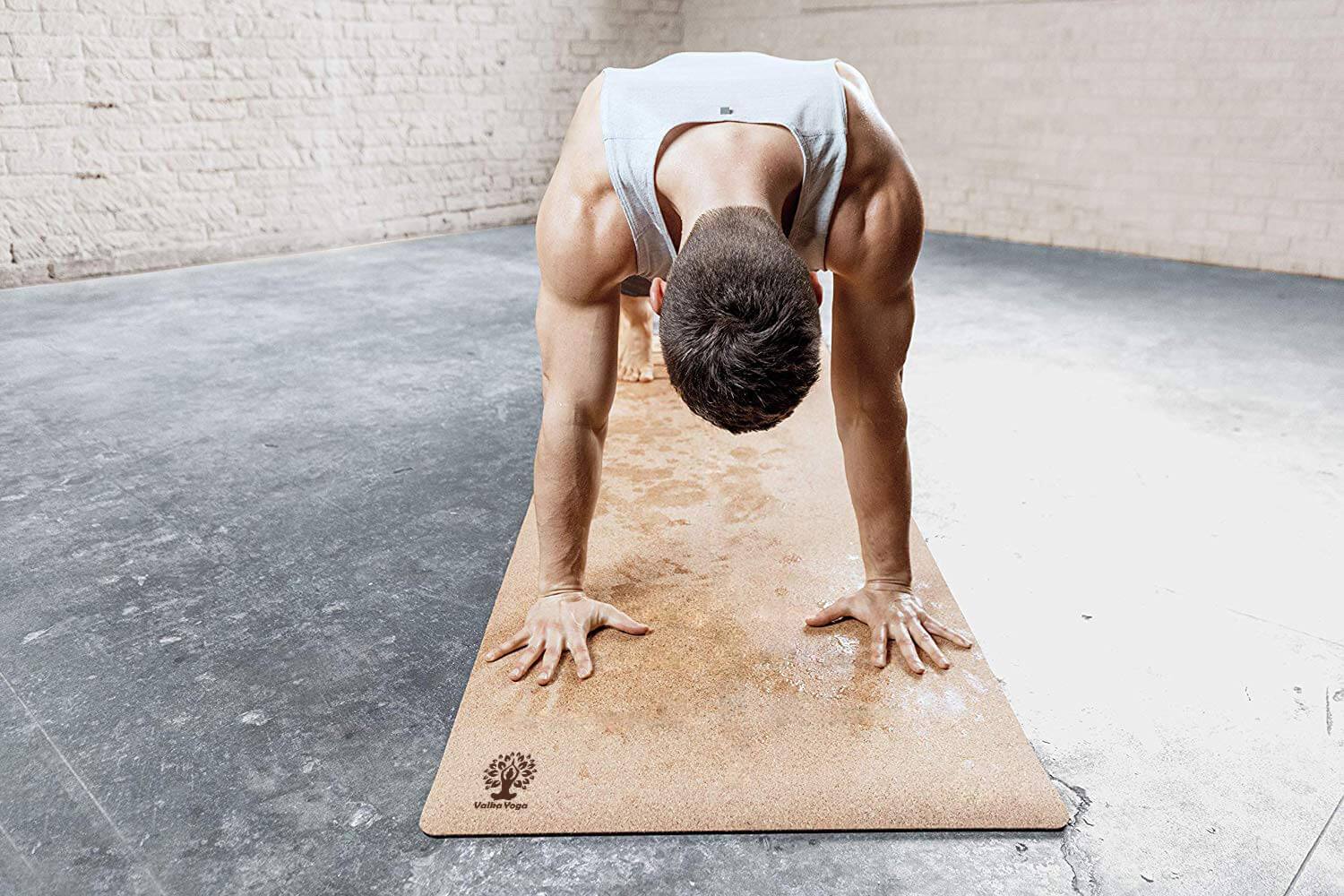 Man practicing on cork yoga mat